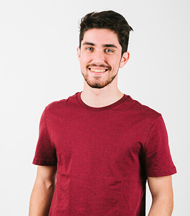 Smiling man in a red shirt.